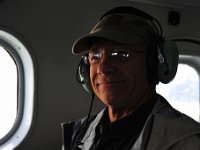 Dad cracks a nervous smile.  It was our first time on a float plane, but it was really fun to fly under the cloud deck!